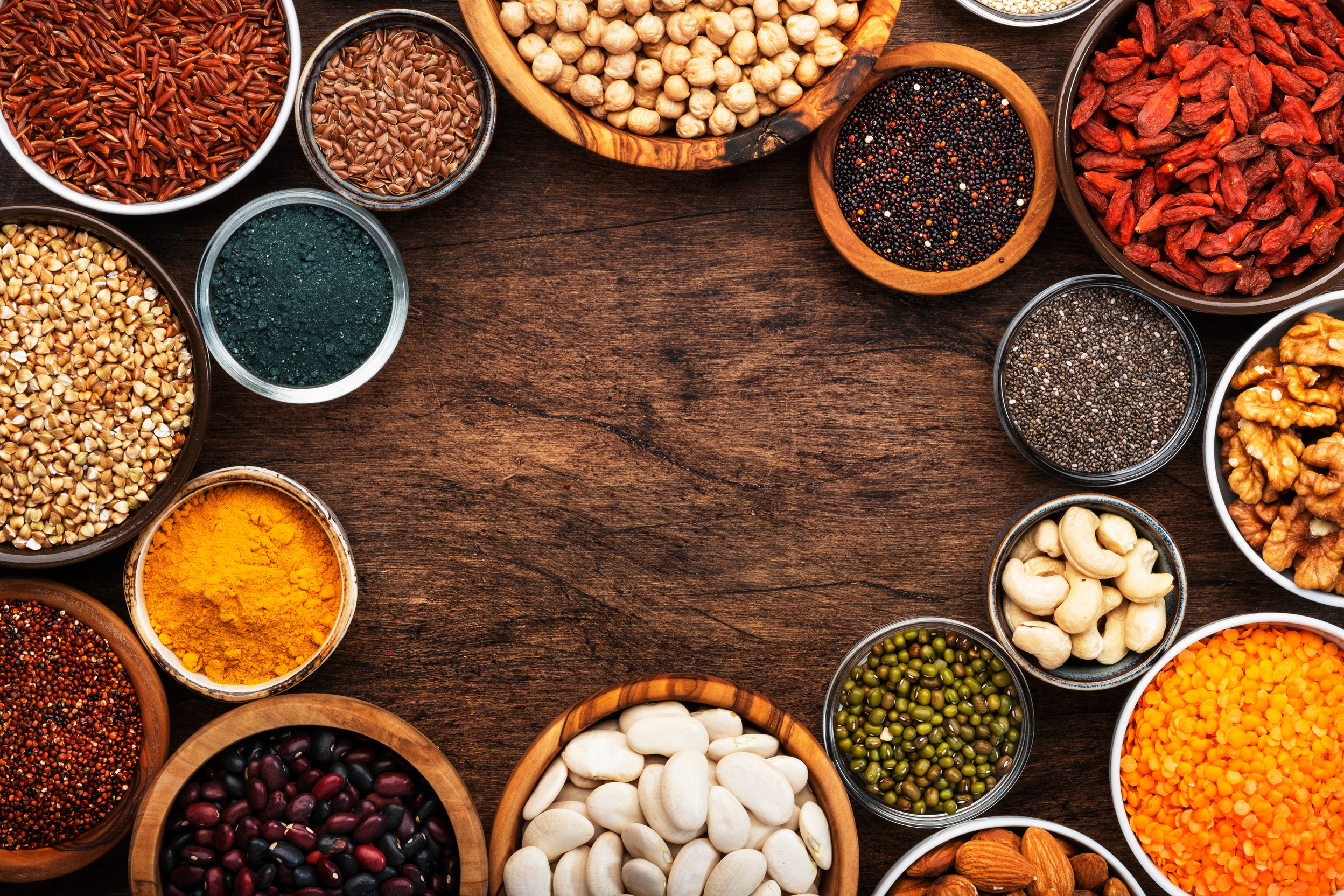 Superfoods, Legumes, Nuts, Seeds and Cereals Set in Bowls Flatlay