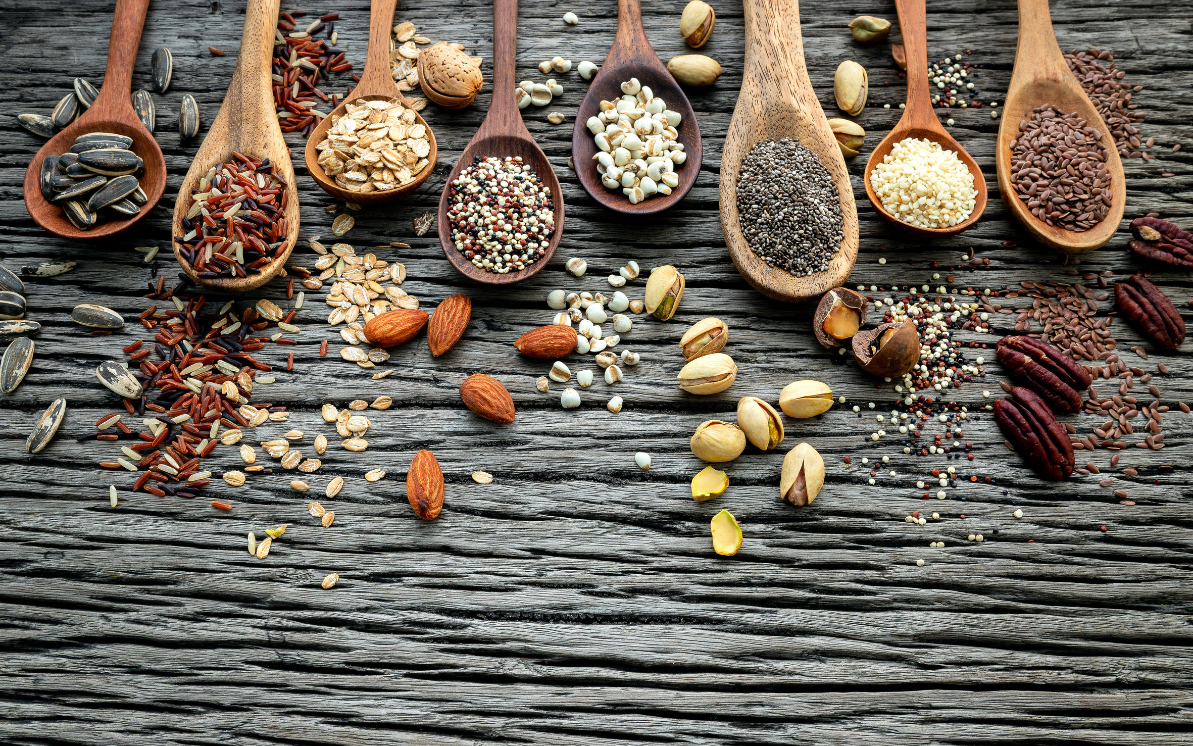 Different Types of Grains and Nuts on Wooden Spoons